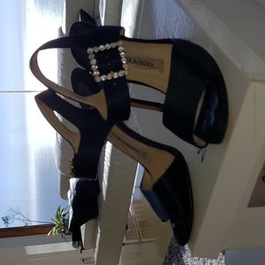 Manolo Blahnik sandals with Swarovski crystal buckles.